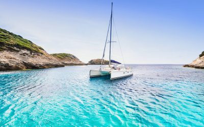 Beautiful bay with sailing boat catamaran, Corsica island, Franc